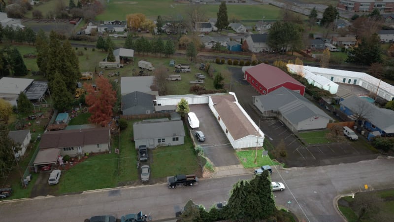 Aerial view of J & J Mini-Storage showing 507 and 485 Harrison St locations in residential neighborhood of Lebanon, Oregon
